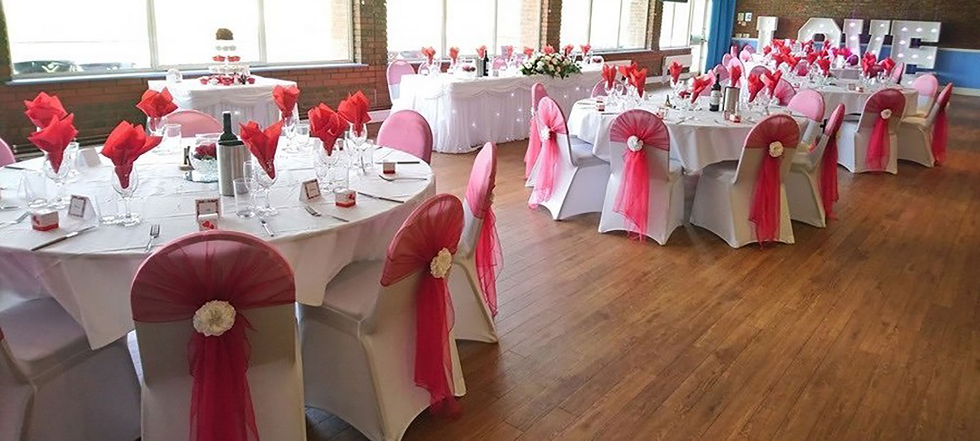 wedding-room-hire-newbury-red-chairs